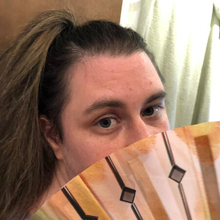 A selfie where I’m covering my face with a Kyoshi Fan
